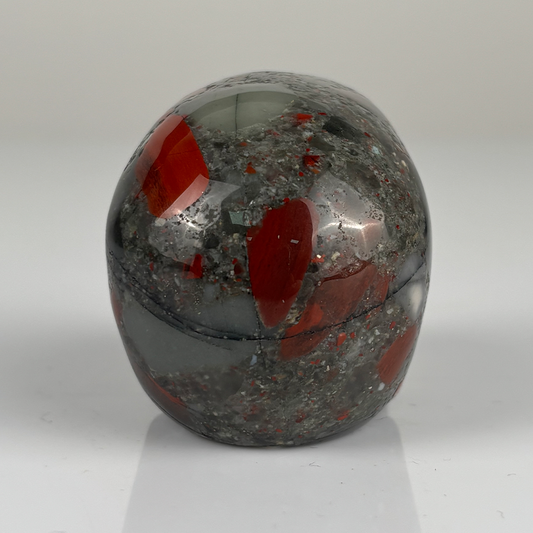 Back view of a 2-inch African Bloodstone human skull carving