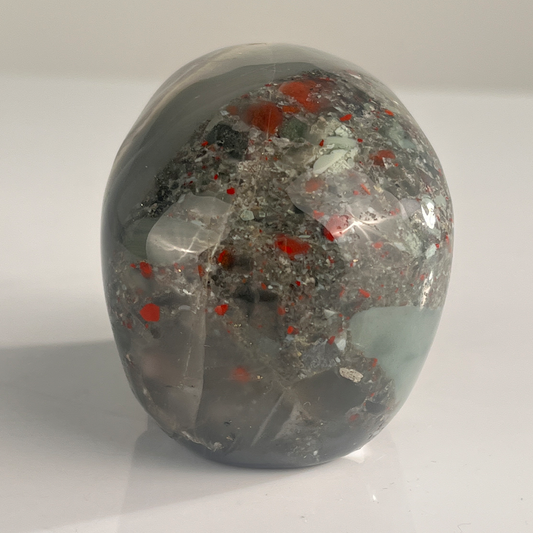 Back view of a 3-inch African Bloodstone human skull carving