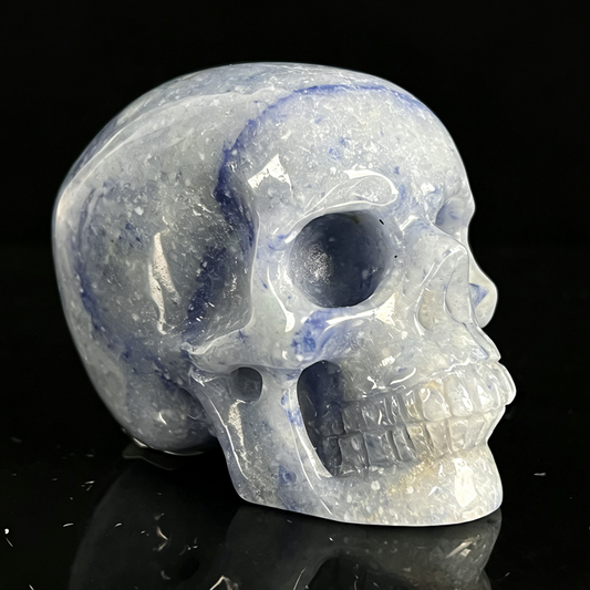 Right-front view of a 2-inch Blue Aventurine human skull carving