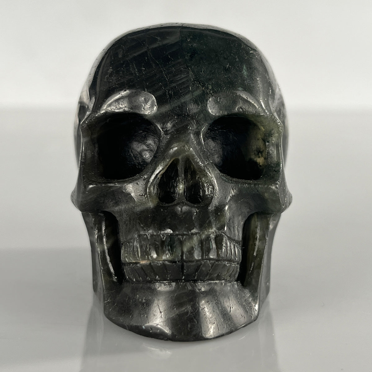 Front view of a 3-inch Blue Labradorite human skull carving