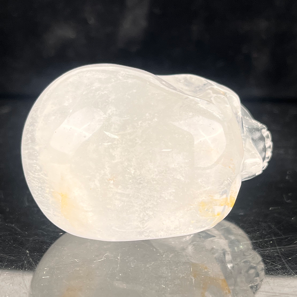 Top view of a 2-inch Clear Quartz human skull carving