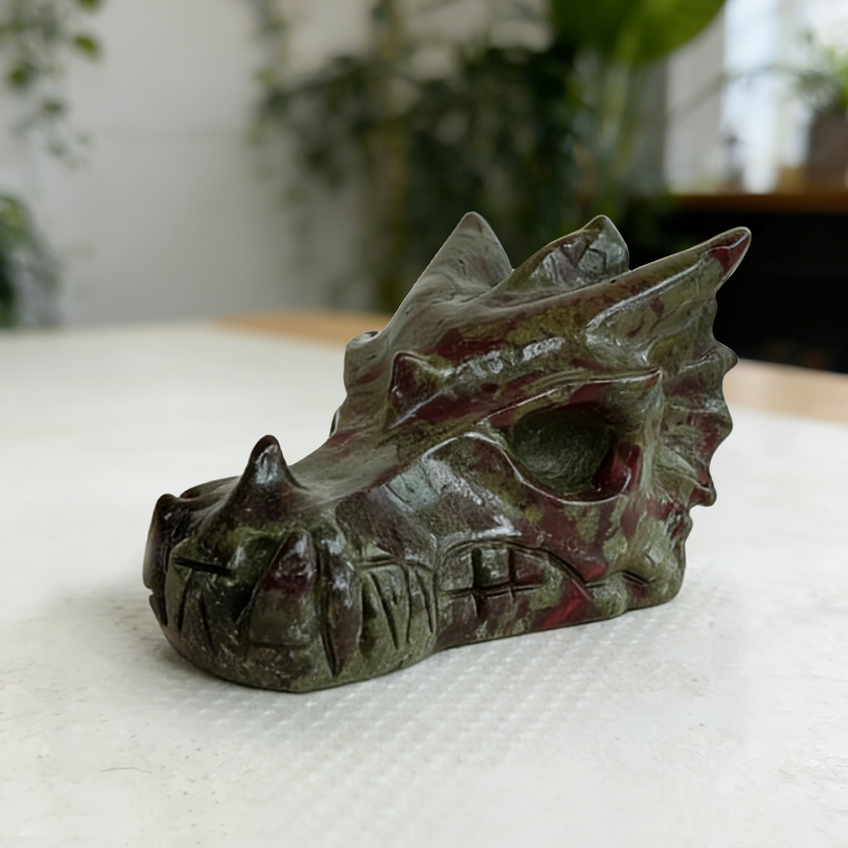 Additional view of a 2-inch Dragon Bloodstone dragon skull carving