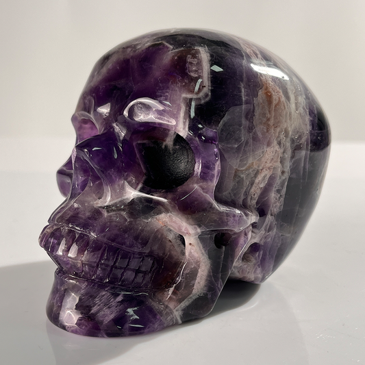 Additional view of a 4.5-inch Dream Amethyst human skull carving