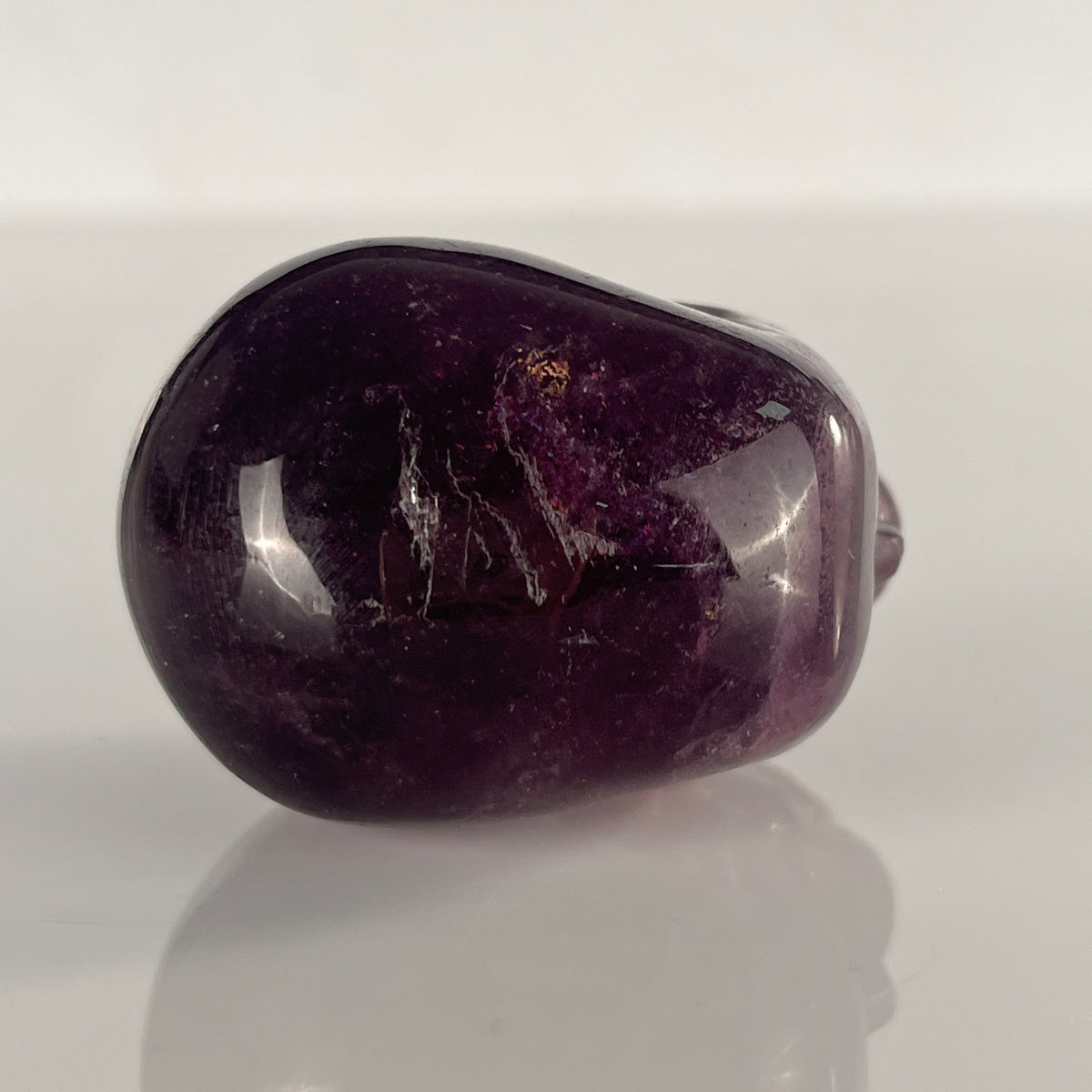 Top view of a 2-inch Fluorite human skull carving