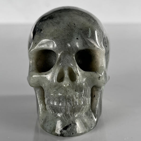 Front view of a 3-inch Grey Labradorite human skull carving