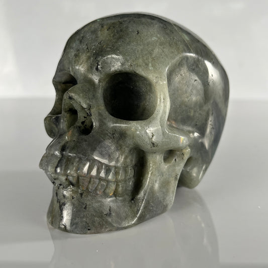 Left-front view of a 4.5-inch Grey Labradorite human skull carving