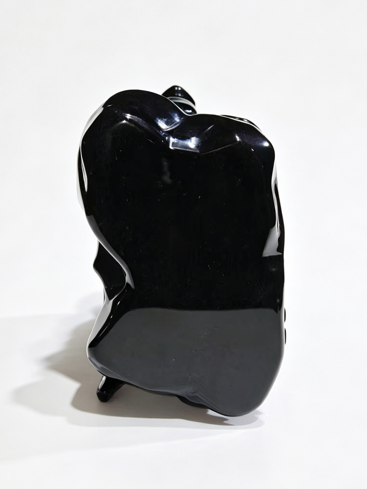 Additional view of a one-of-a-kind Black Obsidian skull and winged dragon sculpture