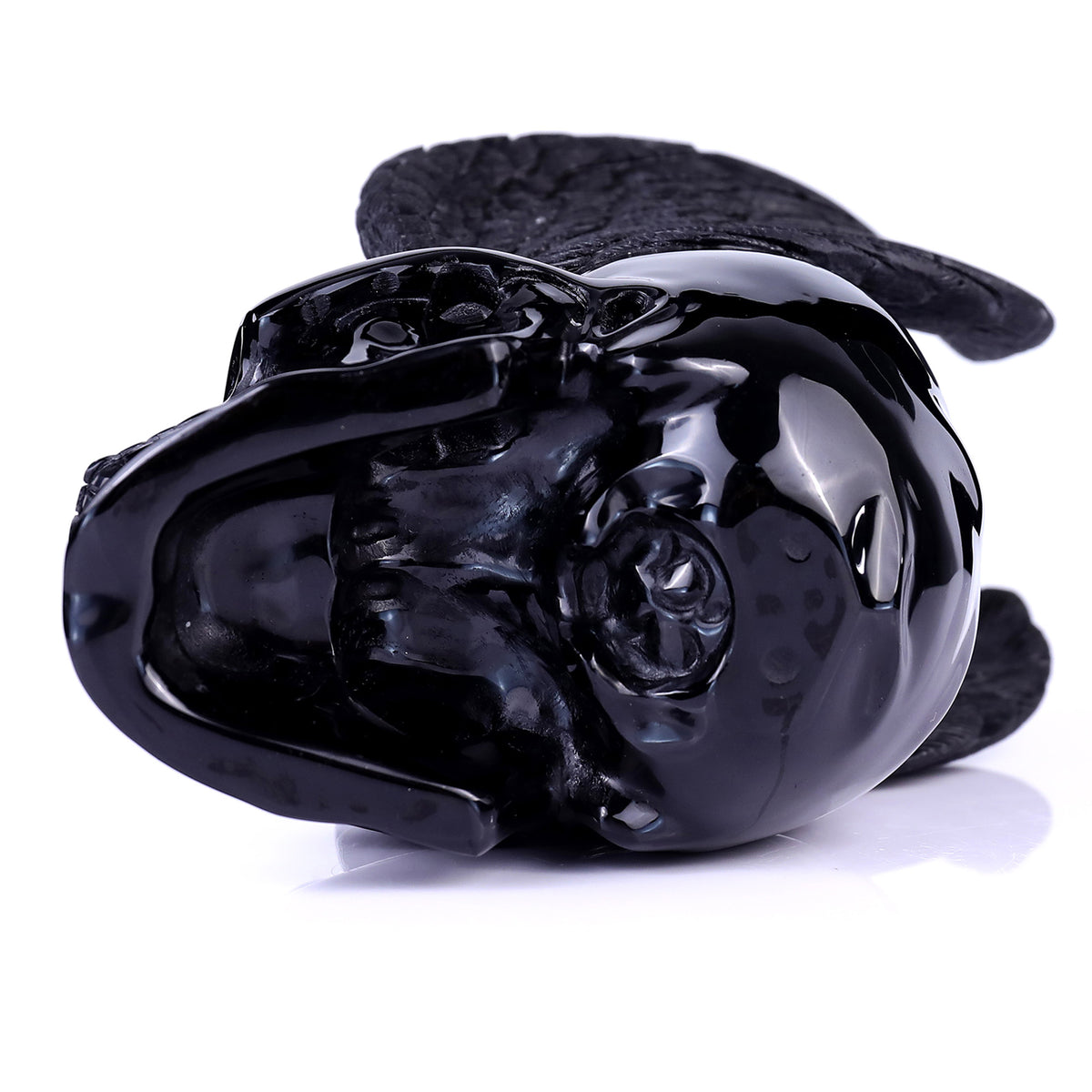 Top view of a one-of-a-kind Black Obsidian winged skull carving