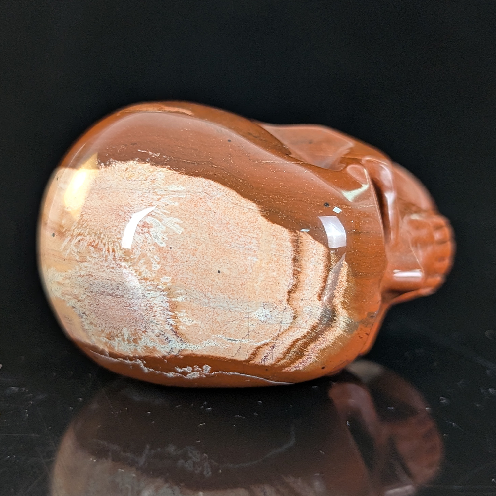 Top view of a 2-inch Red Jasper human skull carving