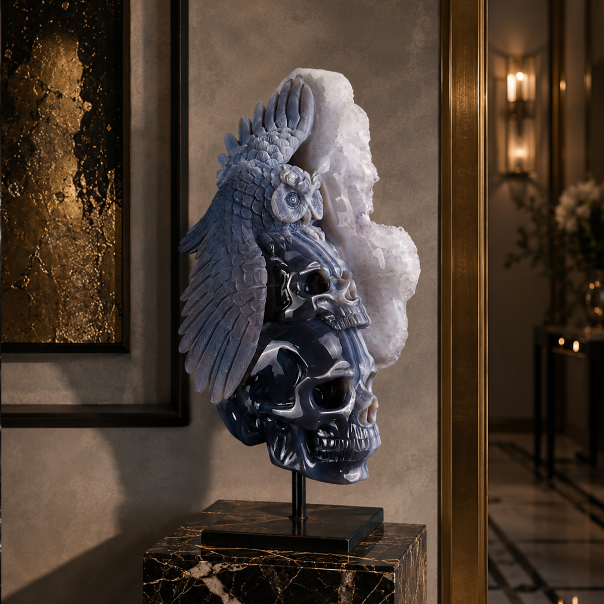 Dark stone sculpture displayed in a warmly lit room