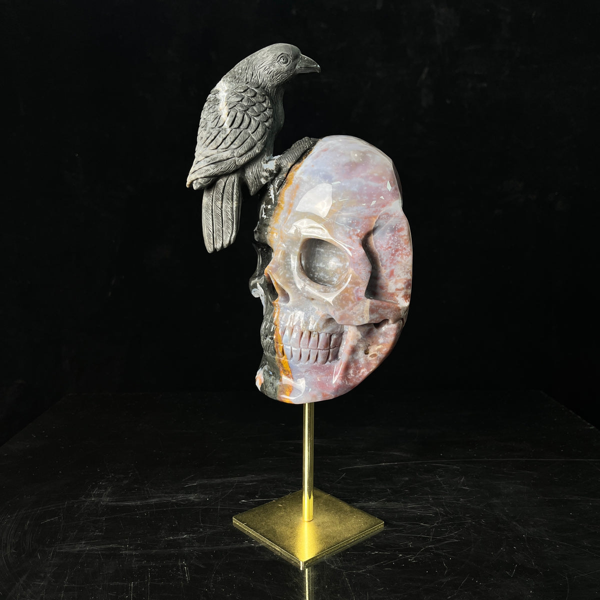 The Twofold Witness — Indian Agate Human Skull & Raven Sculpture · Specimen No. 61