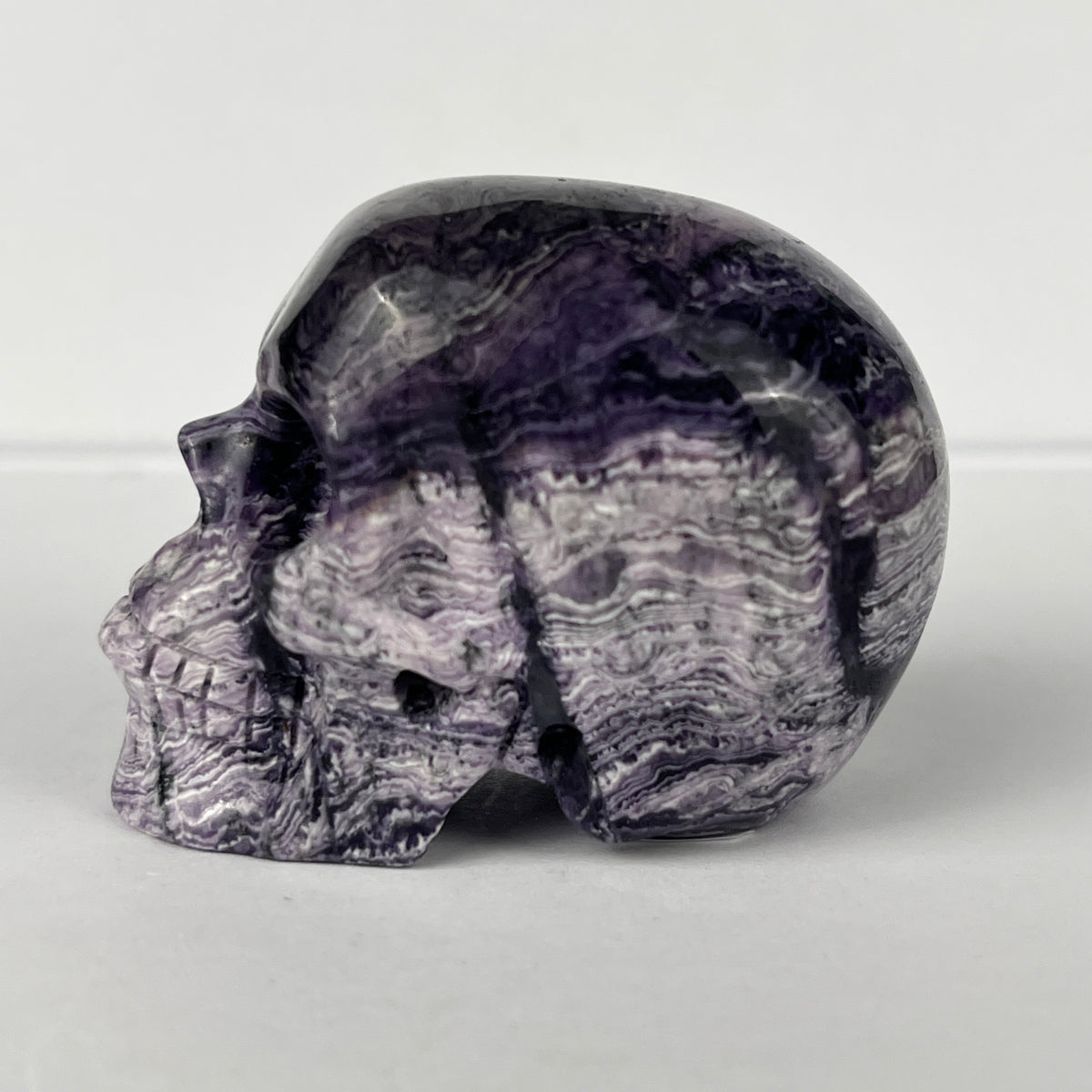 2" Purple Peacock Stone Crystal Skull - Pattern F