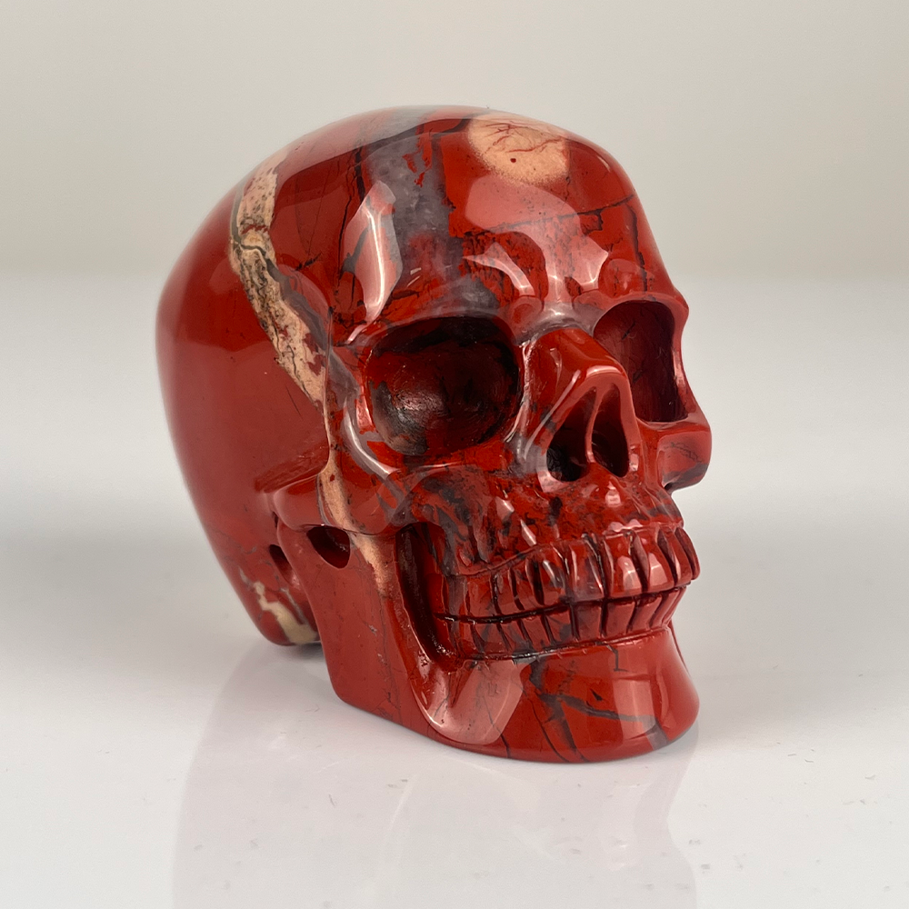 Crâne en cristal de jaspe rouge de 7,6 cm