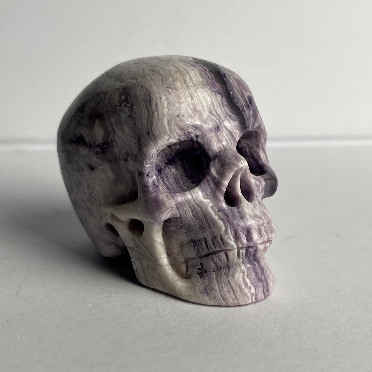 2" Purple Peacock Stone Crystal Skull - Pattern E