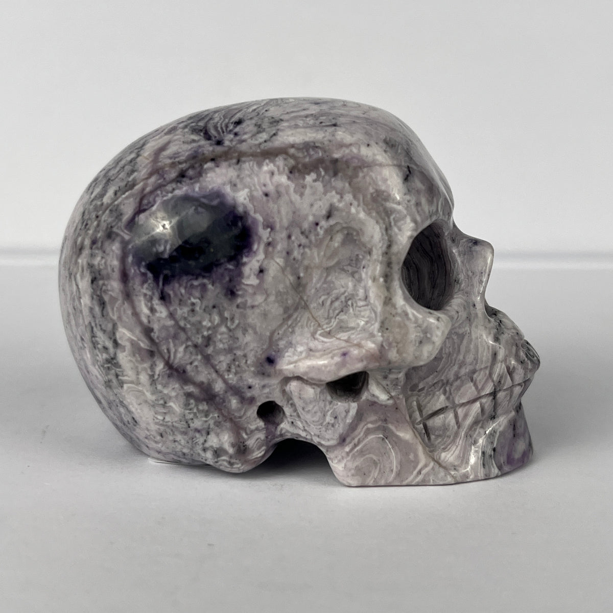 2" Purple Peacock Stone Crystal Skull - Pattern D