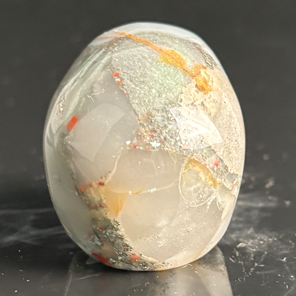 Back view of a 2-inch African Bloodstone human skull carving
