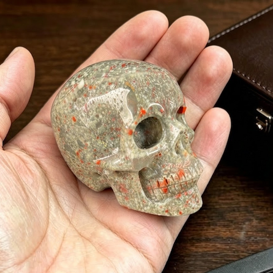 Main view of a 2-inch African Bloodstone human skull carving