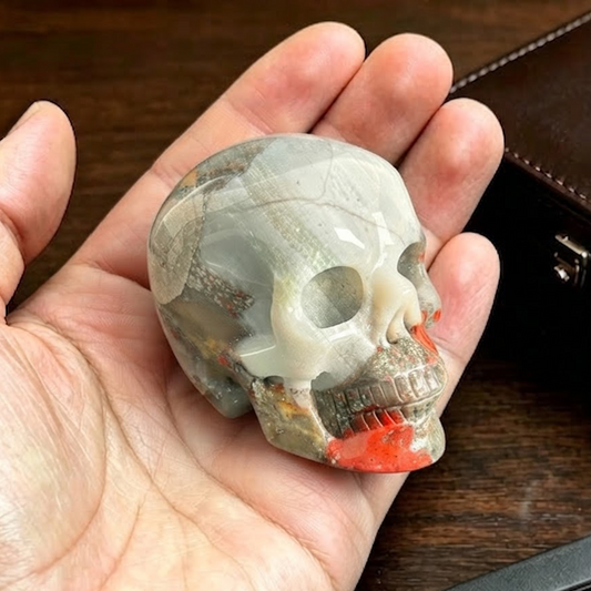 Main view of a 2-inch African Bloodstone human skull carving