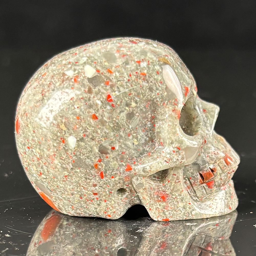 Right view of a 2-inch African Bloodstone human skull carving