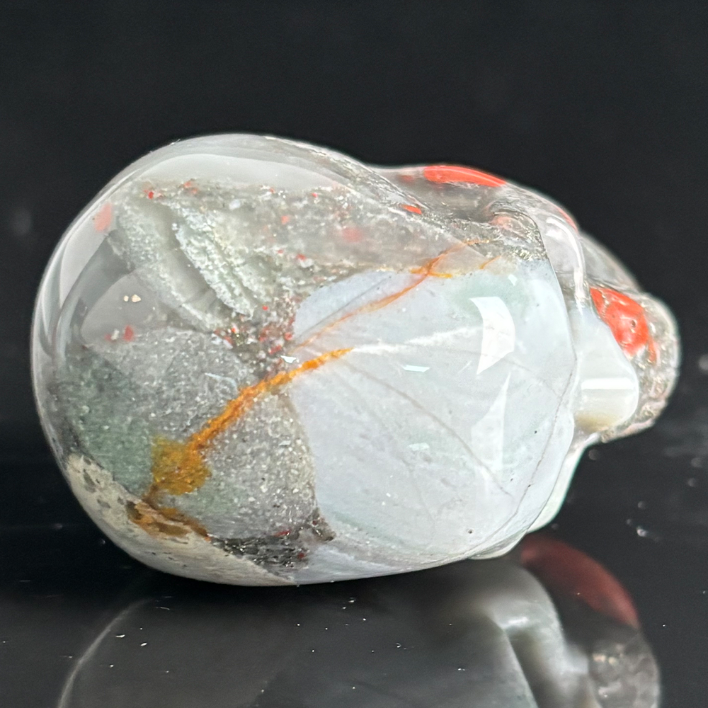 Top view of a 2-inch African Bloodstone human skull carving