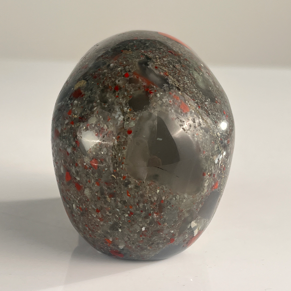 Back view of a 3-inch African Bloodstone human skull carving