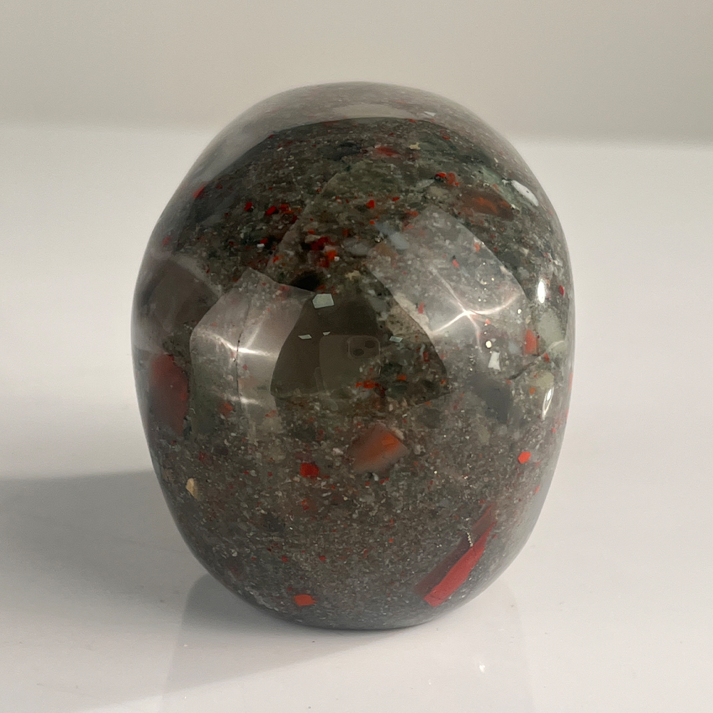 Back view of a 3-inch African Bloodstone human skull carving