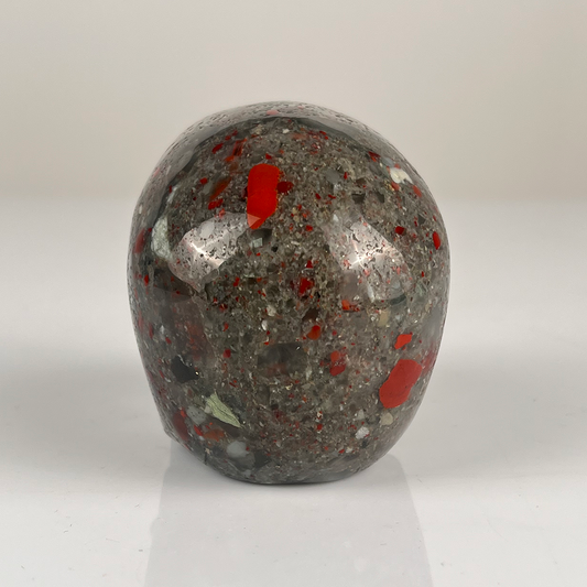 Back view of a 3-inch African Bloodstone human skull carving