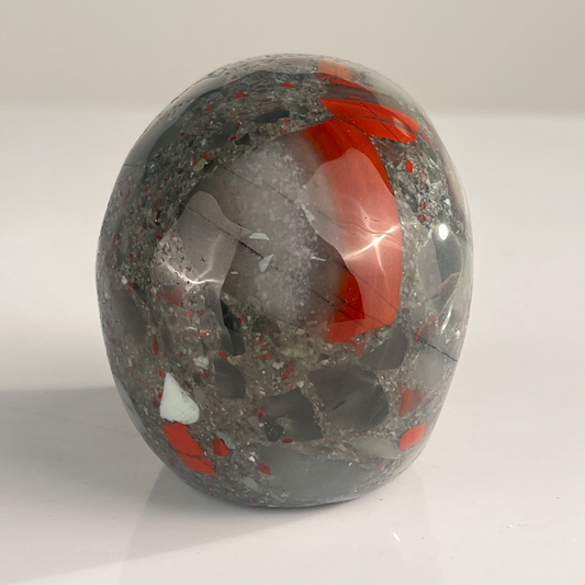Back view of a 3-inch African Bloodstone human skull carving