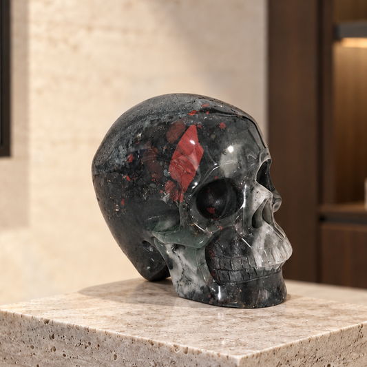 Main view of a 3-inch African Bloodstone human skull carving