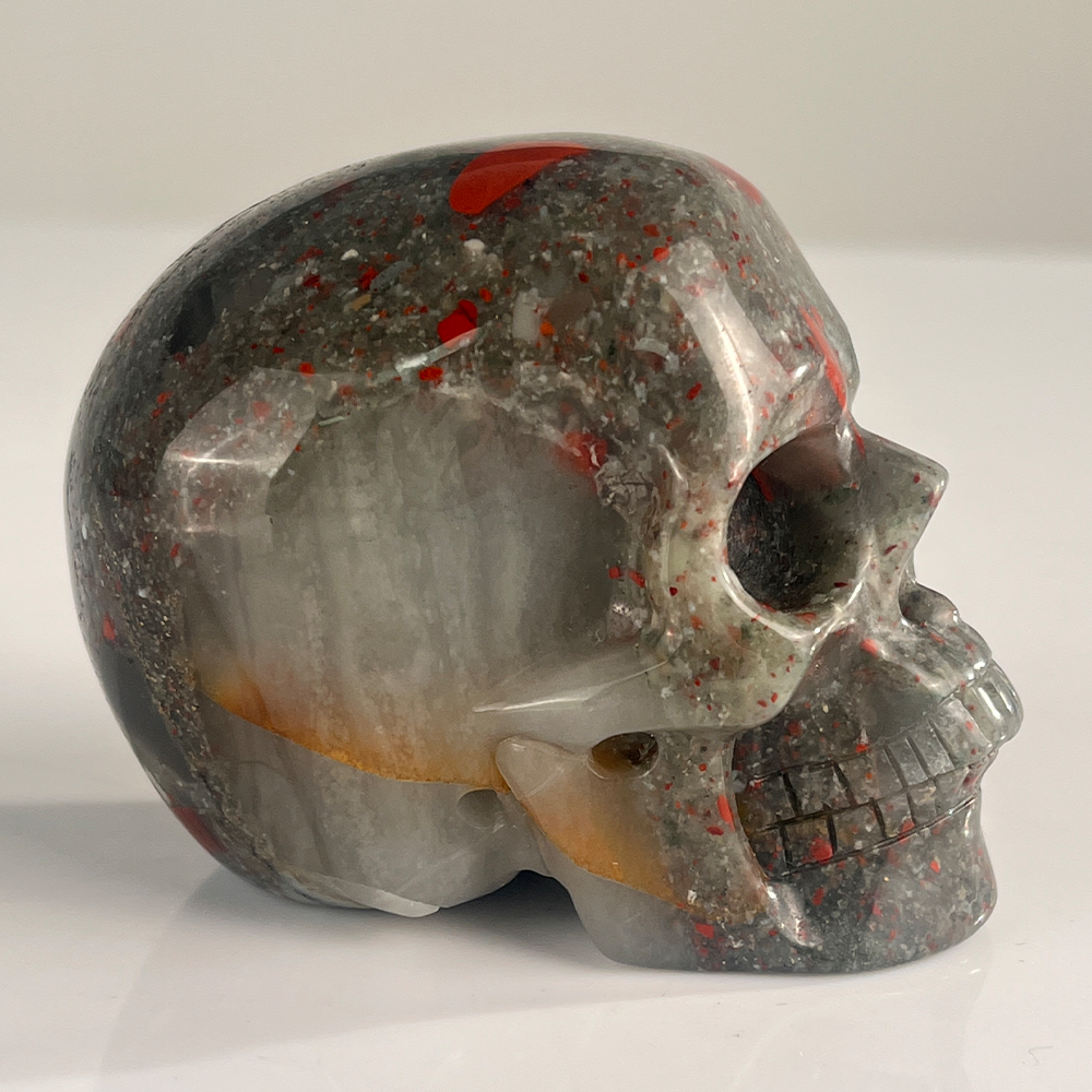 Right view of a 3-inch African Bloodstone human skull carving