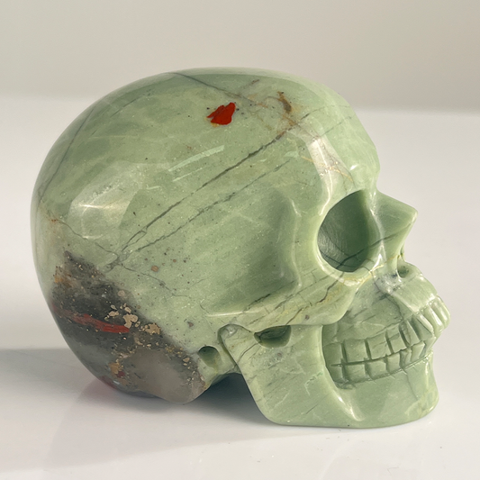 Right view of a 3-inch African Bloodstone human skull carving