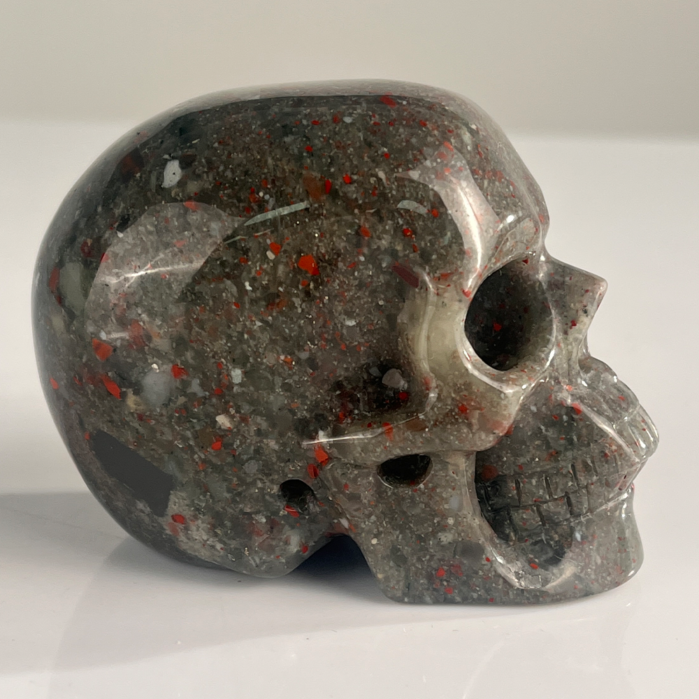 Right view of a 3-inch African Bloodstone human skull carving