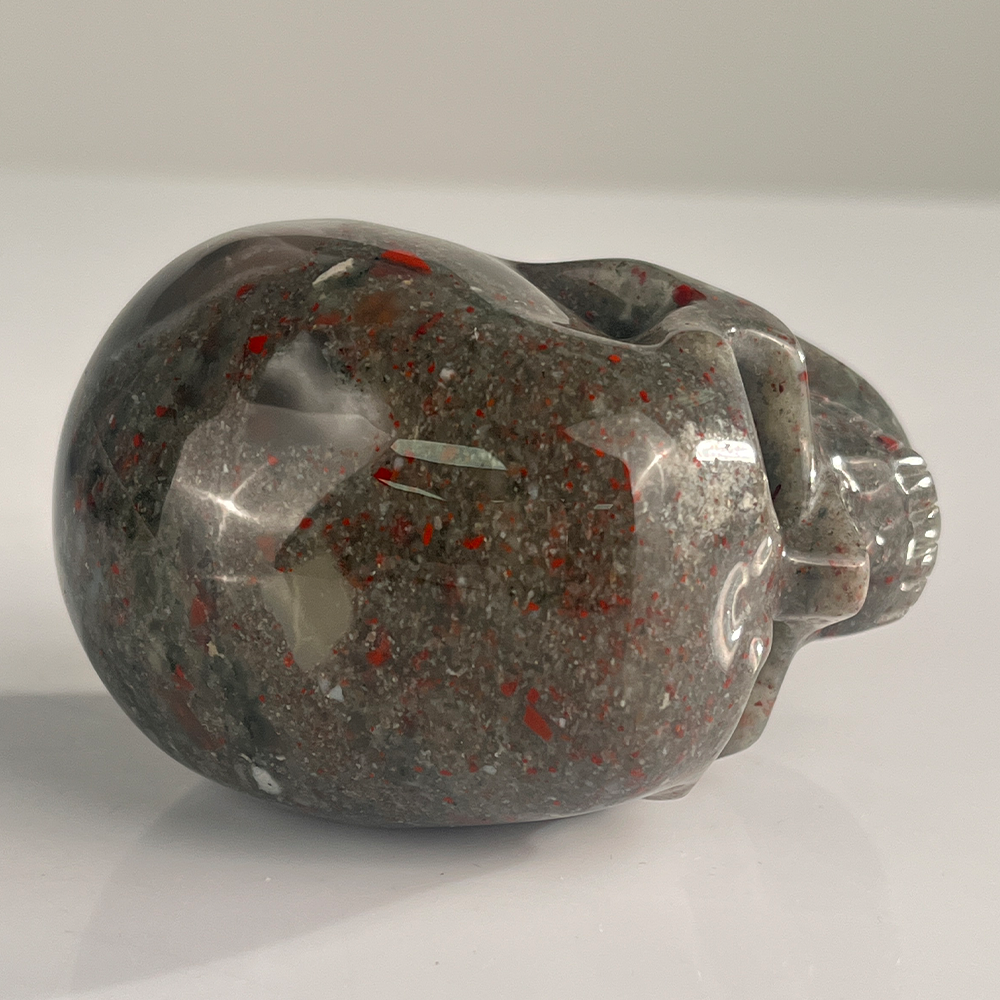 Top view of a 3-inch African Bloodstone human skull carving