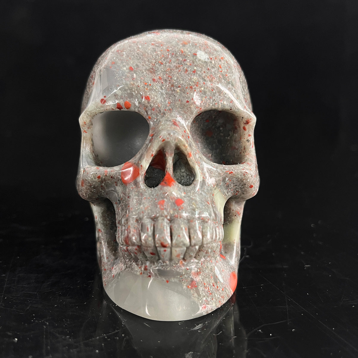 Front view of a 4.5-inch African Bloodstone human skull carving