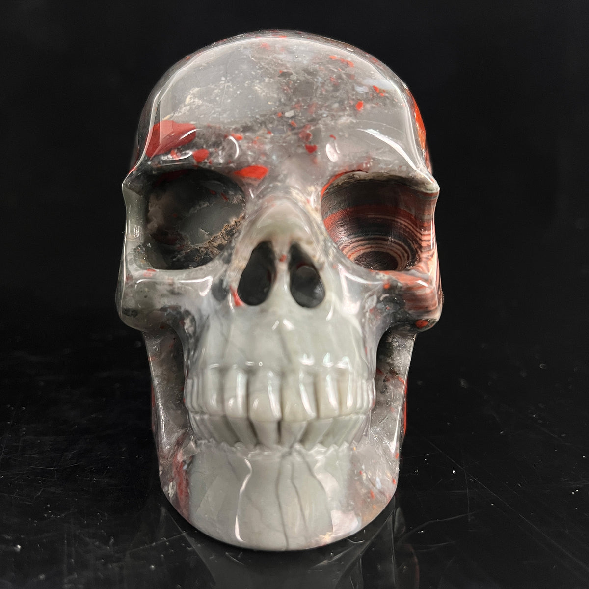 Front view of a 4.5-inch African Bloodstone human skull carving