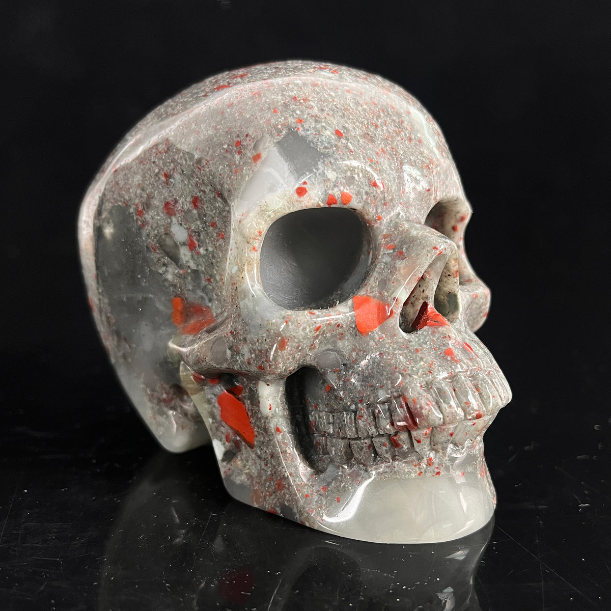 Right-front view of a 4.5-inch African Bloodstone human skull carving