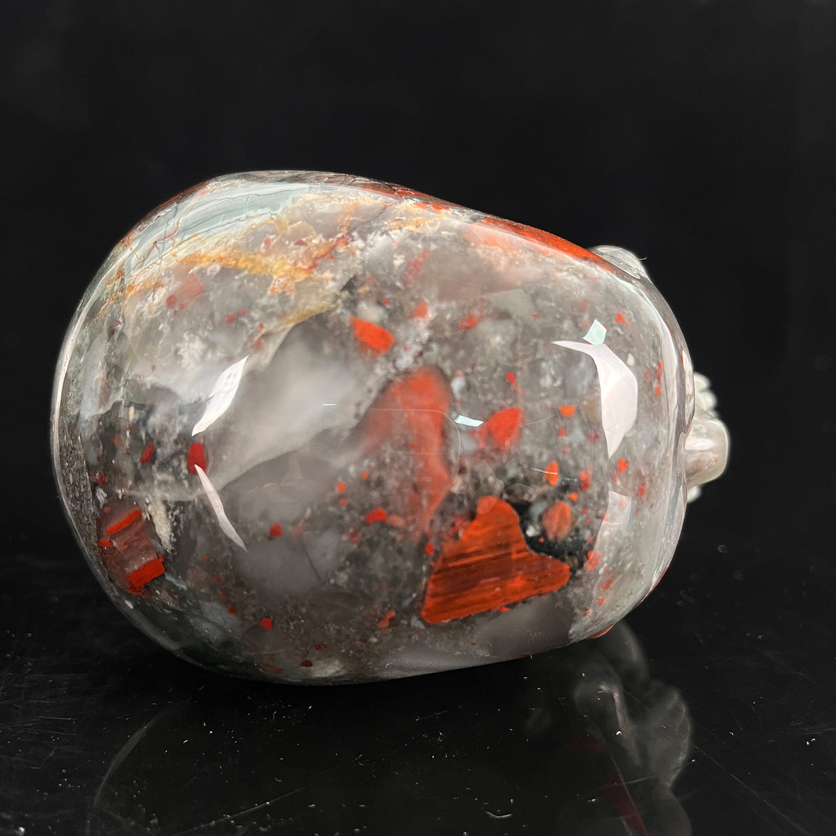 Top view of a 4.5-inch African Bloodstone human skull carving