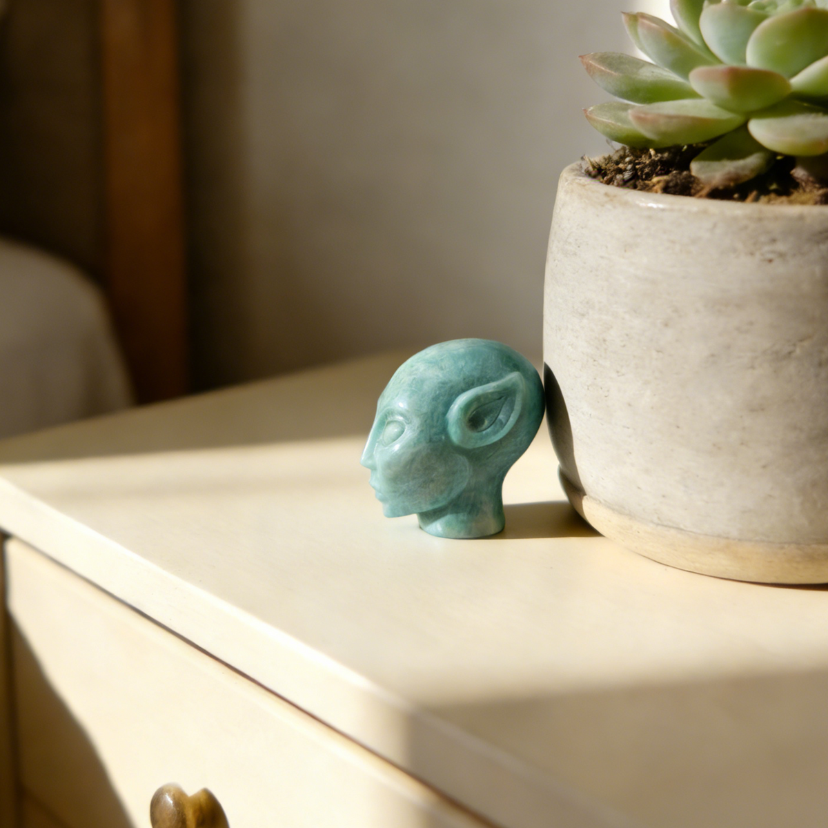 Additional view of a 2-inch Amazonite alien skull carving