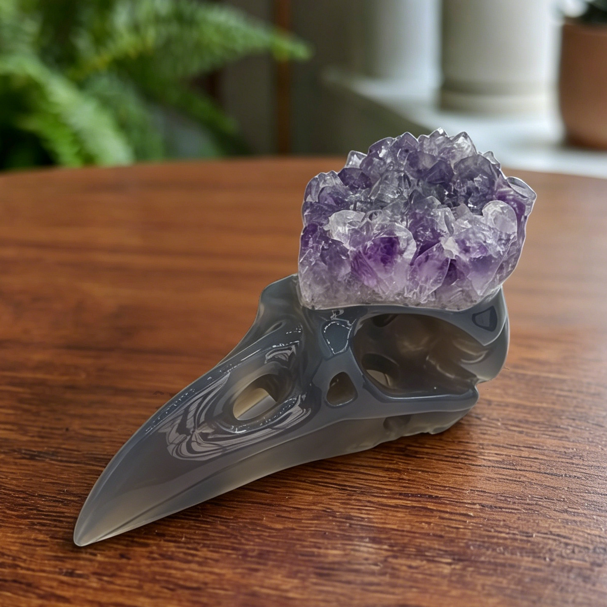 Additional view of a 3.5-inch Amethyst Cluster raven skull carving