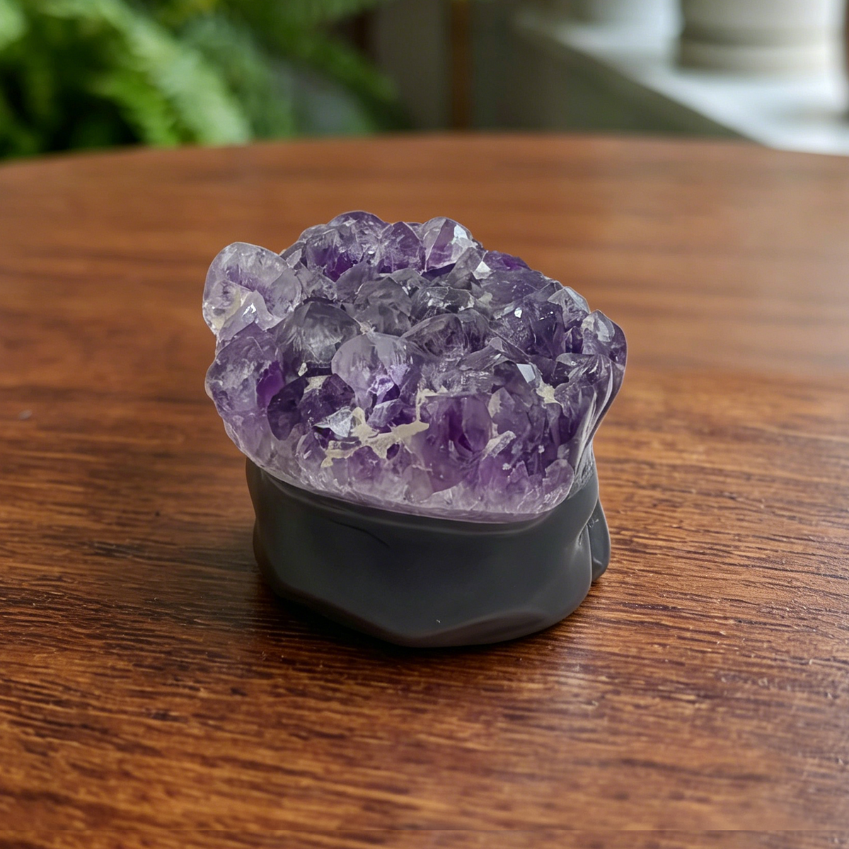 Additional view of a 3.5-inch Amethyst Cluster raven skull carving
