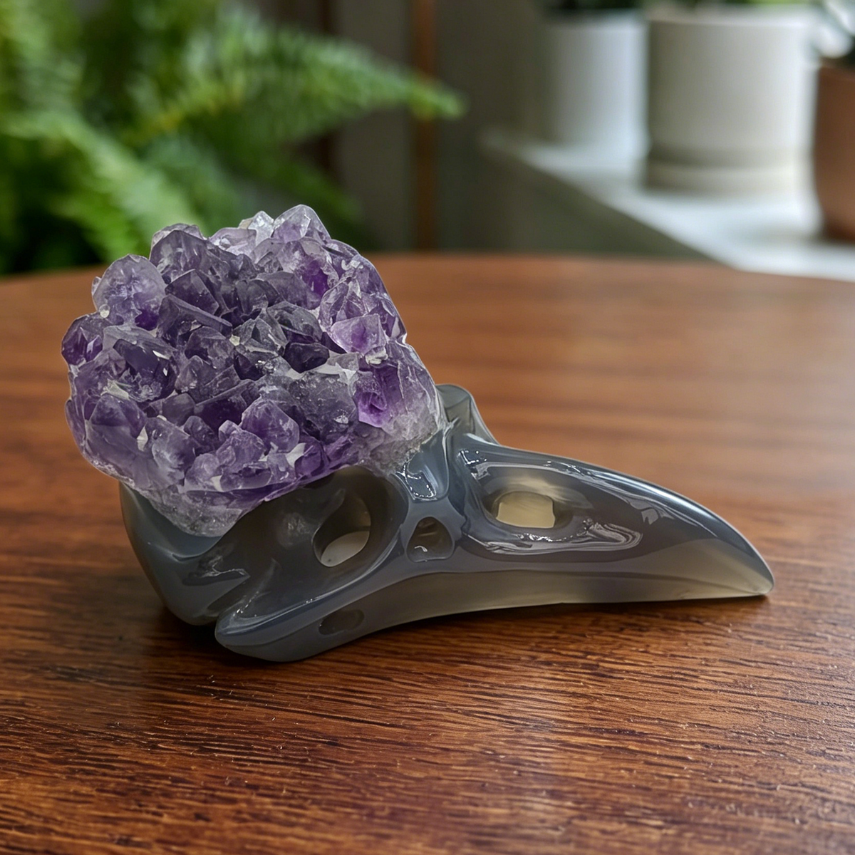 Additional view of a 3.5-inch Amethyst Cluster raven skull carving