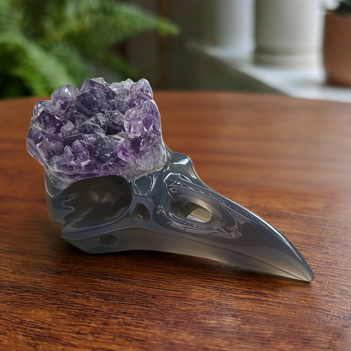 Additional view of a 3.5-inch Amethyst Cluster raven skull carving