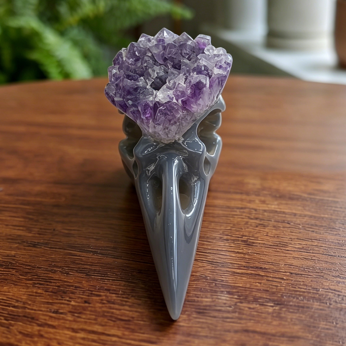 Additional view of a 3.5-inch Amethyst Cluster raven skull carving