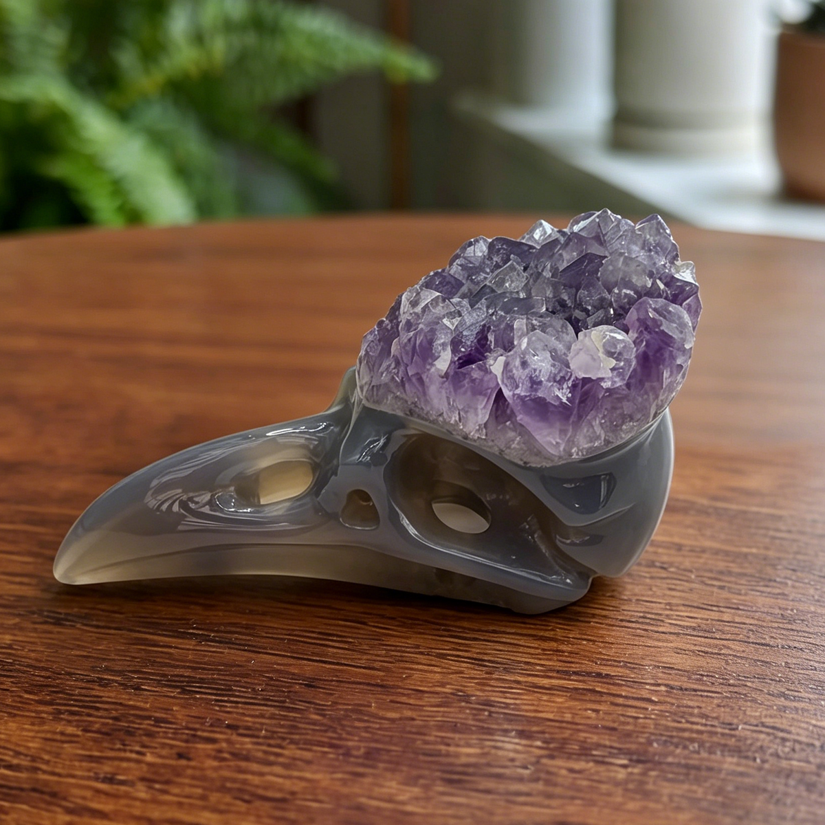 Additional view of a 3.5-inch Amethyst Cluster raven skull carving
