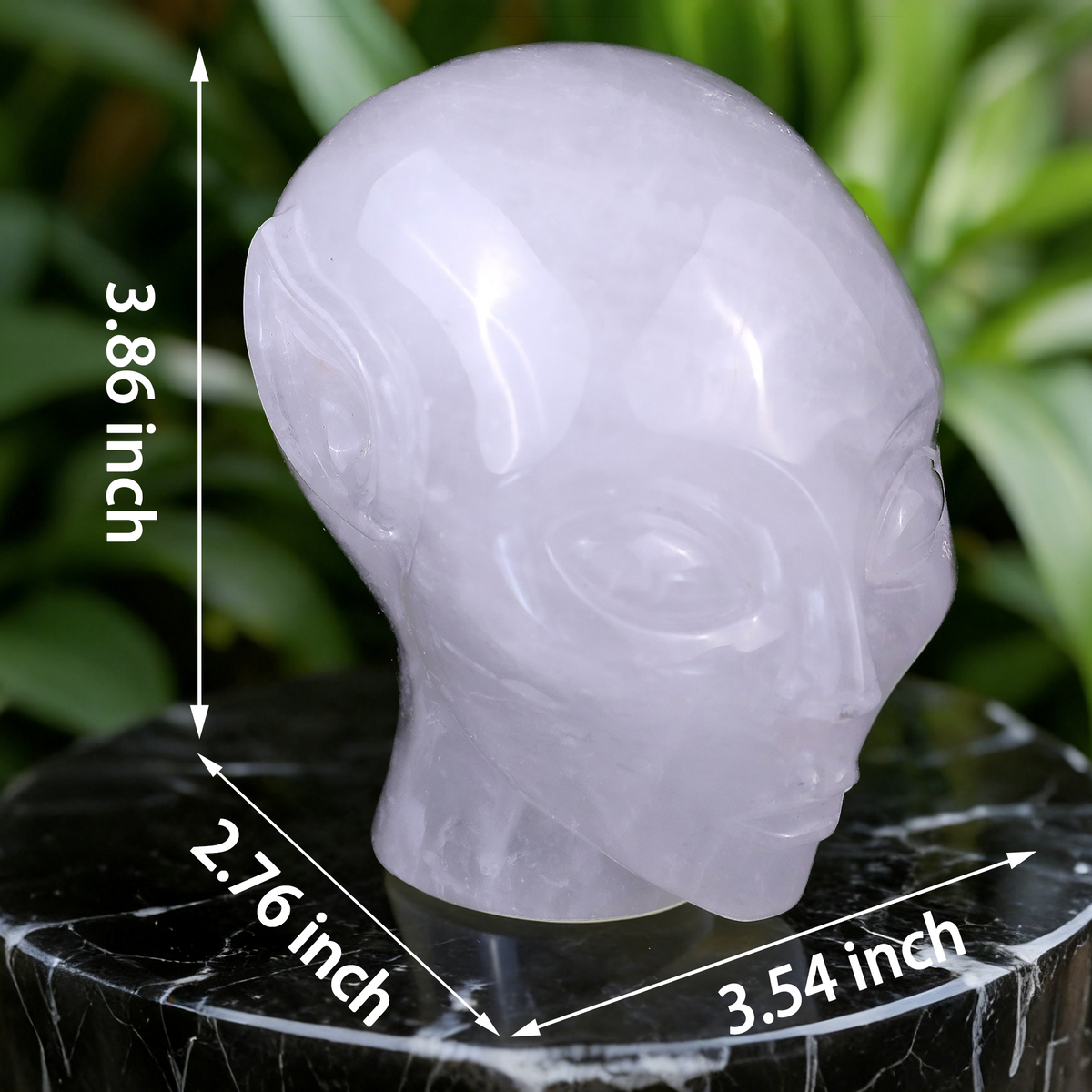 Additional view of a 3.8-inch Angola Quartz alien skull carving