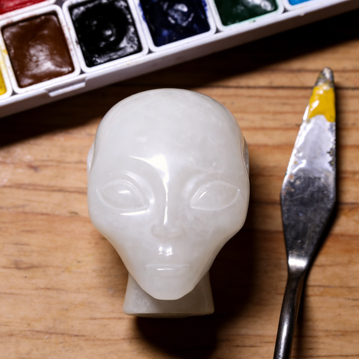 Additional view of a 3.8-inch Angola Quartz alien skull carving