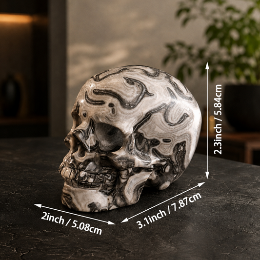 Additional view of a 3-inch Black Crazy Lace Agate human skull carving