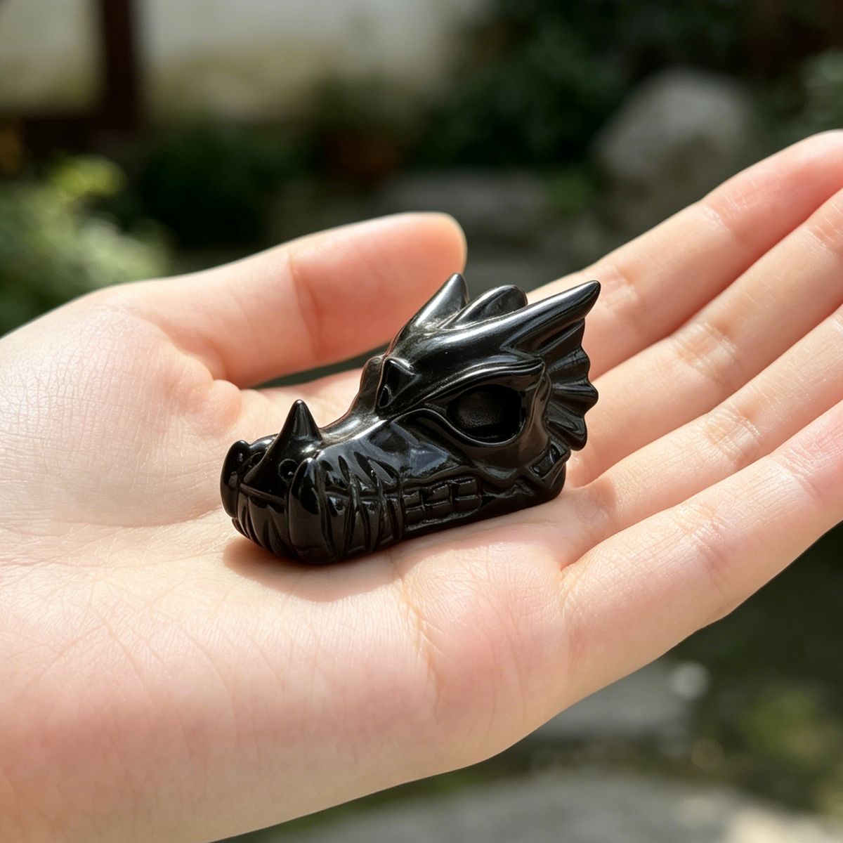 Additional view of a 2-inch Black Obsidian dragon skull carving