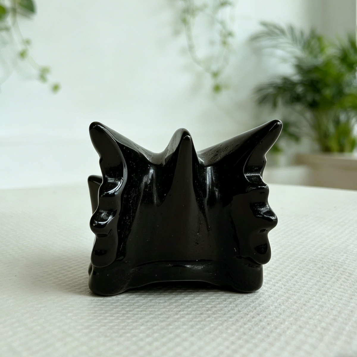 Additional view of a 2-inch Black Obsidian dragon skull carving