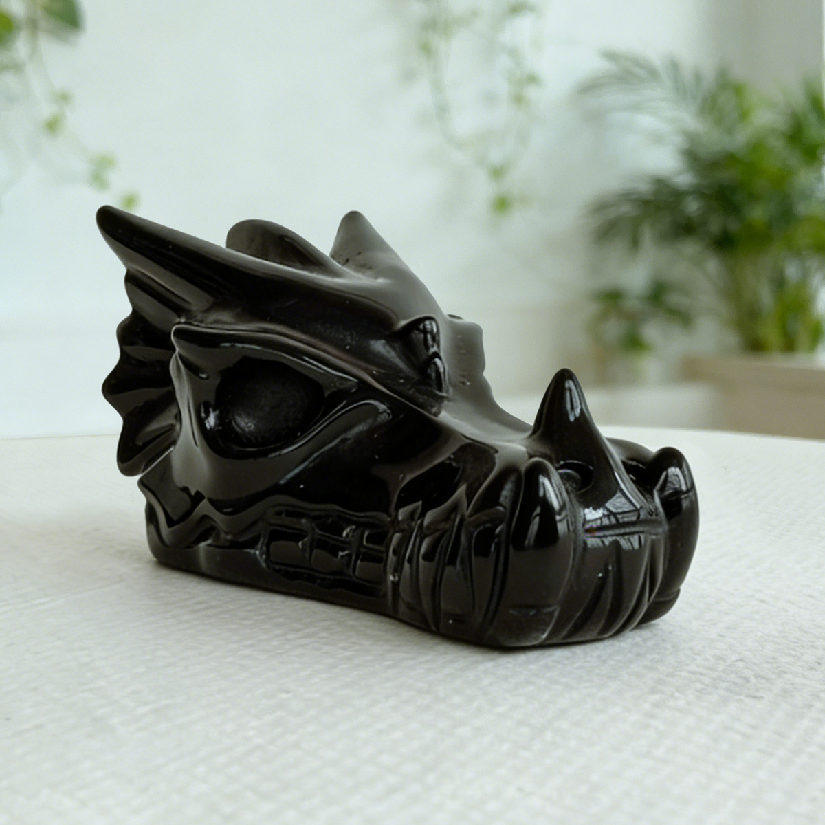 Additional view of a 2-inch Black Obsidian dragon skull carving